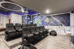 A sport bar movie area with a 120-inch projection screen and PlayStation 4 x2